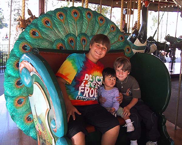 Sophie, Sam and Mason on the Carousel